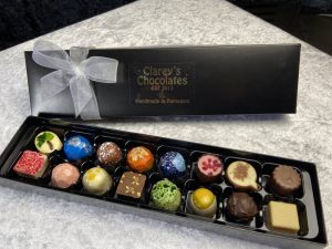 Clareys luxury handmade chocolates presented in black box with bow