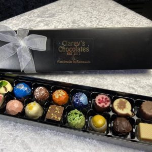 Clareys luxury handmade chocolates presented in black box with bow